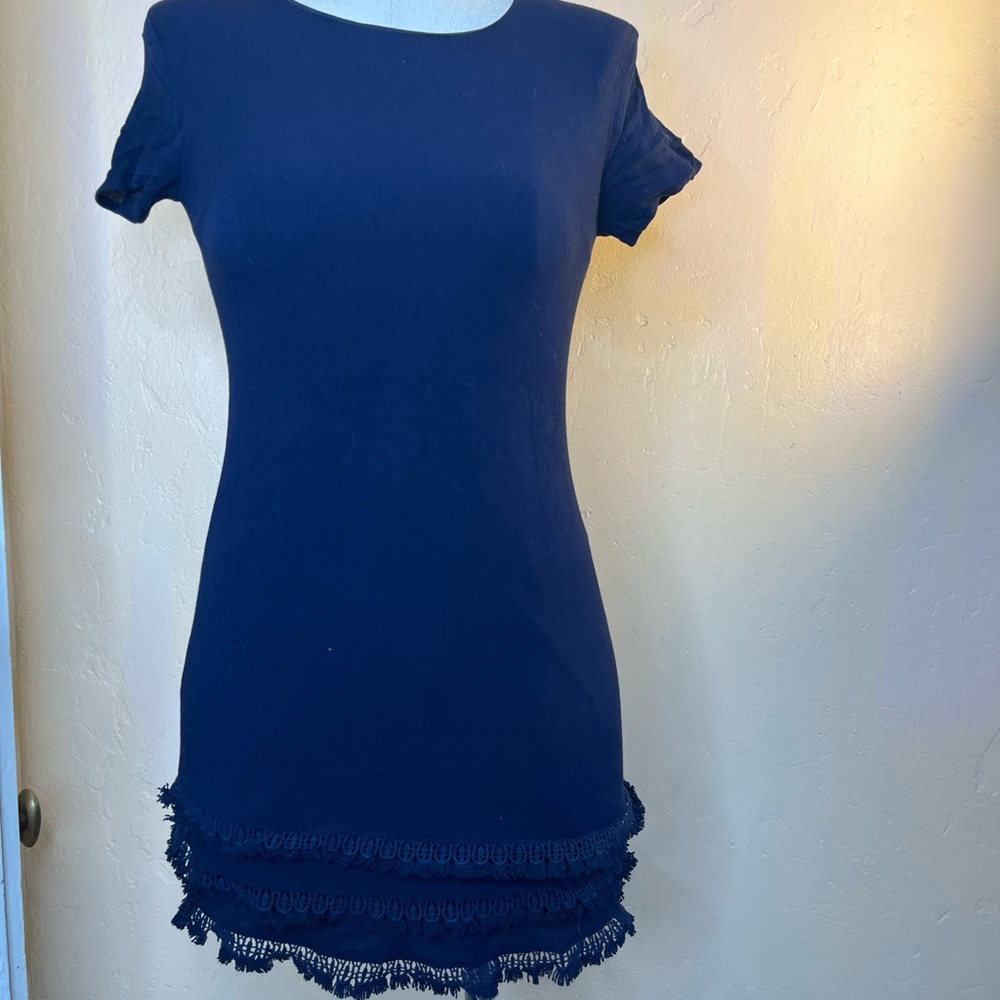 Fitted navy blue dress in GUC with delicate trim on bottom, size xs
